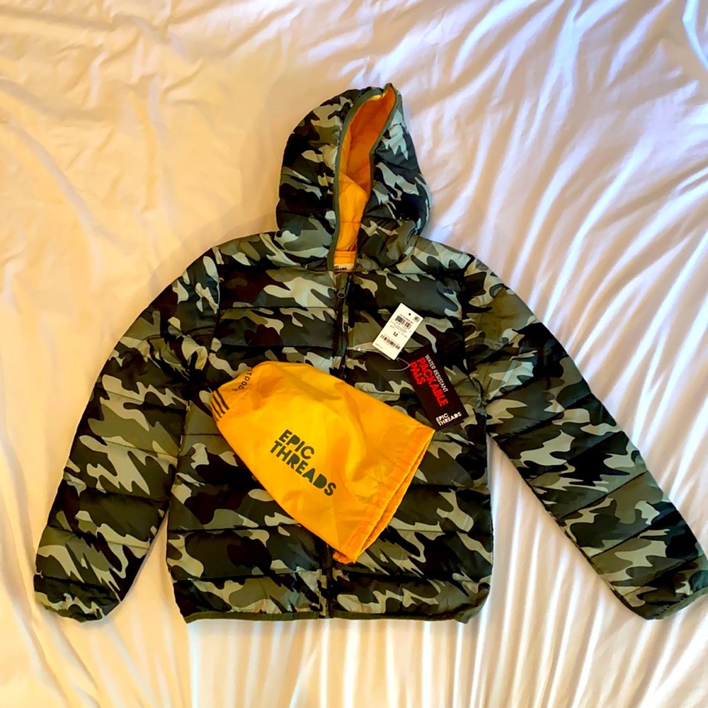 Never used Epic Threads medium to lightweight kids camo puffer. Comes with bag.